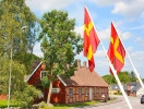Et typisk syn i Skåne: Det lokale flag og bindingsværksidyl